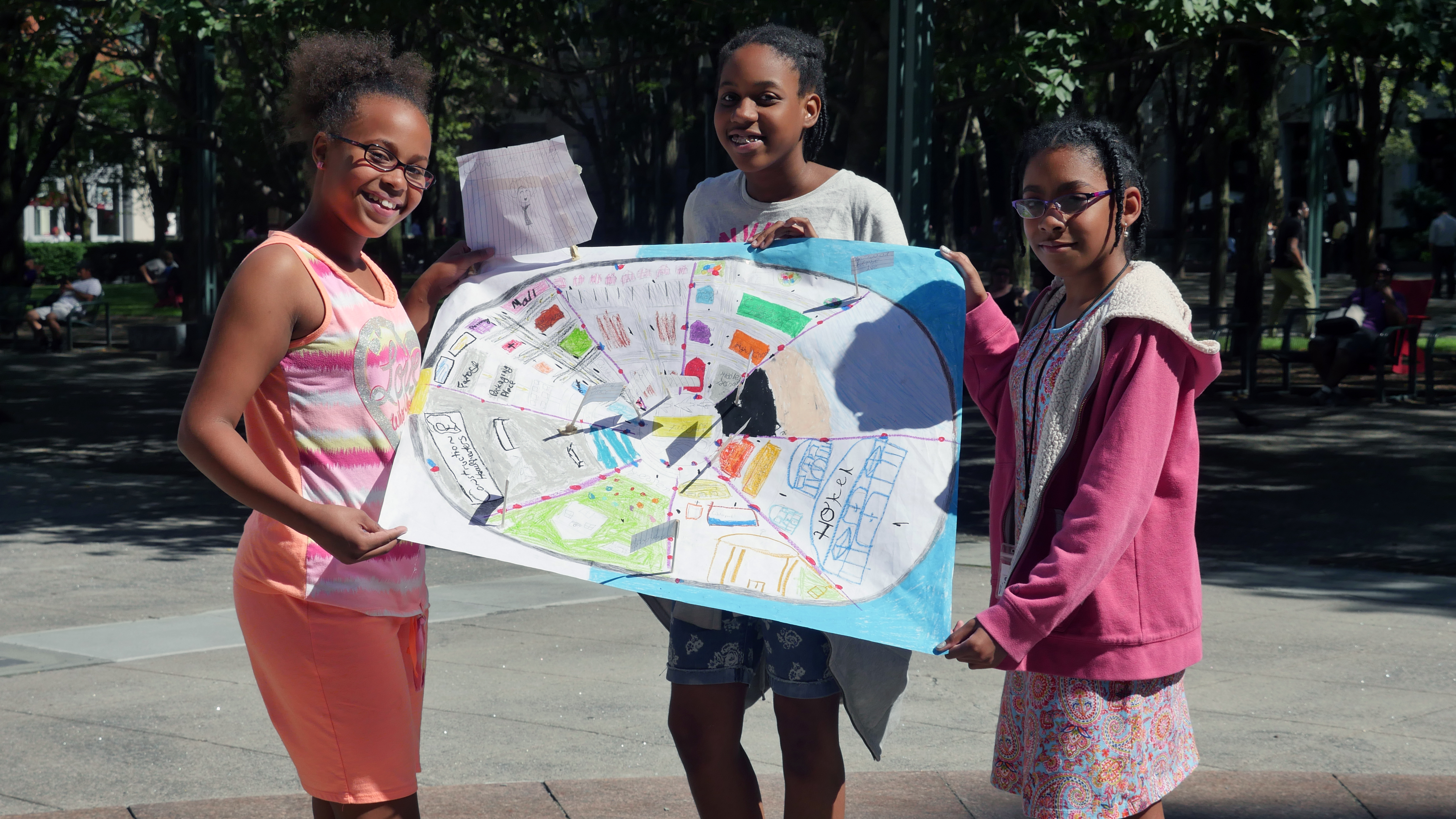 “The reason I included hydro dams and solar power inside of my smart city was because I wanted to use less pollution.” - Isabel (left) “We created these smart cities to show how we can create good transportation routes and improve our cities. We created a way for homes to be more advanced, use solar panels and stuff like that.” - Candice (center) “Transportation... I modelled that in my smart city presentation by adding trains and busses and cars, because people need to get from one place to another, quicker.” - Jaila (right)