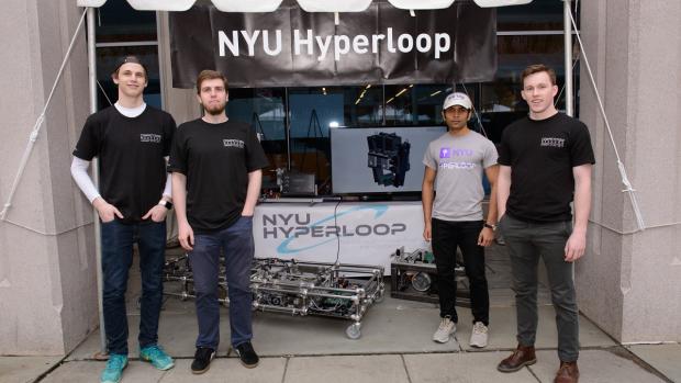 NYU Hyperloop team members with their prototype vehicle at the 2017 NYU Tandon Research Expo