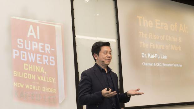 Kai-Fu Lee with image of his book projected behind him