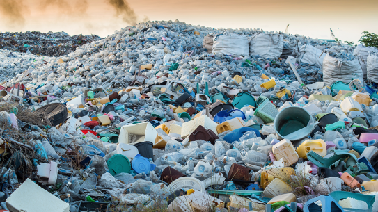 Piles of plastic waste in a landfill.