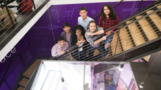 Students posing on the stairs of the MakerSpace for the Brooklyn Showcase