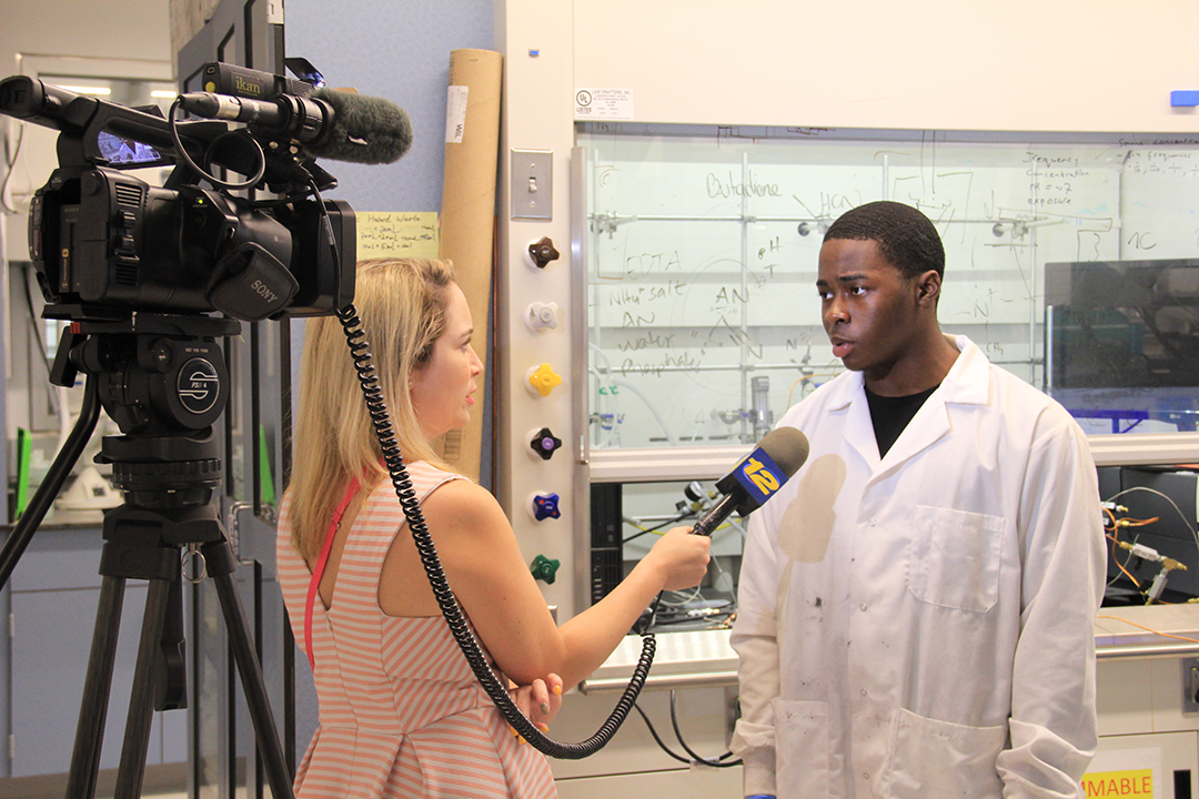 ARISE student being interviewed in a lab 