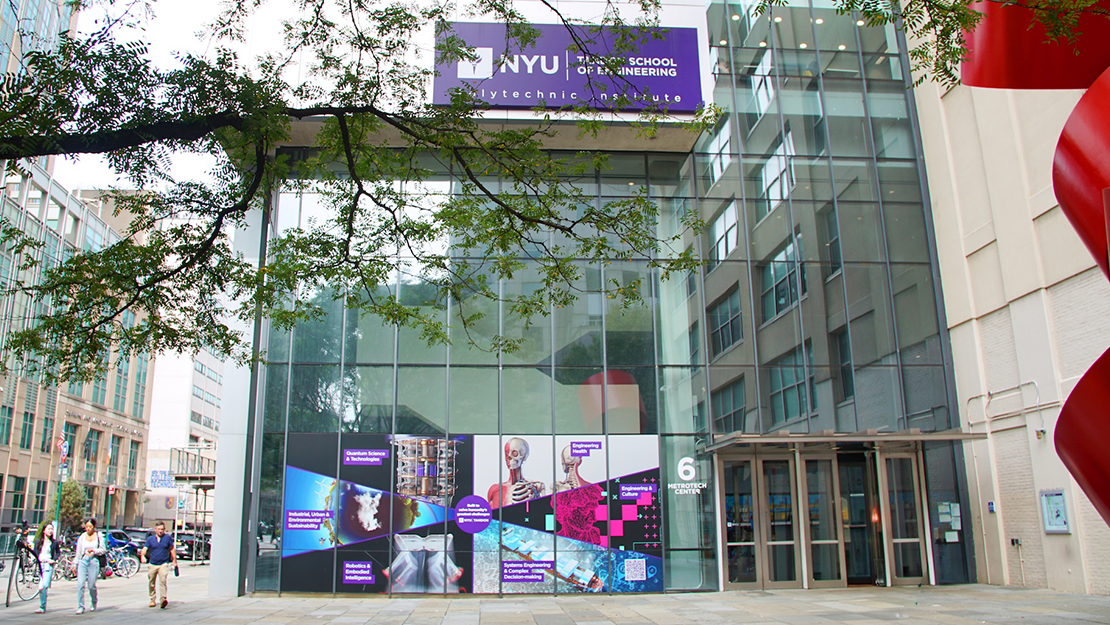 campus building with Tandon branded vinyls showing our 6 areas of impact