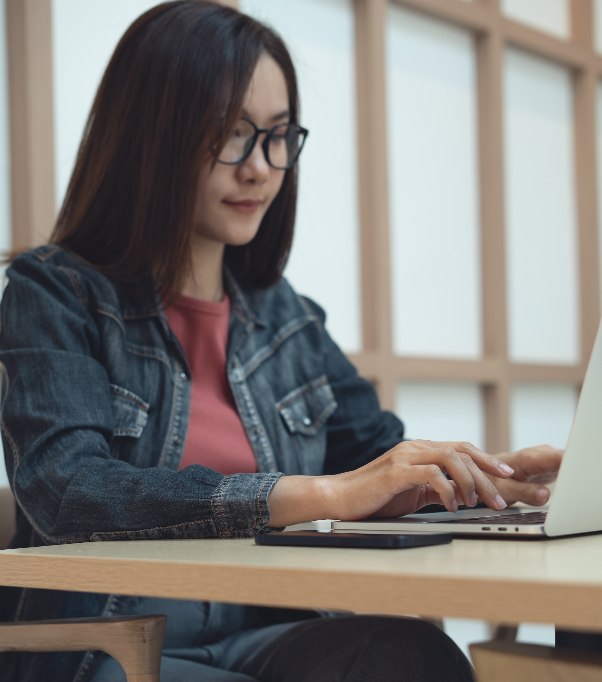 a student working at a laptop 