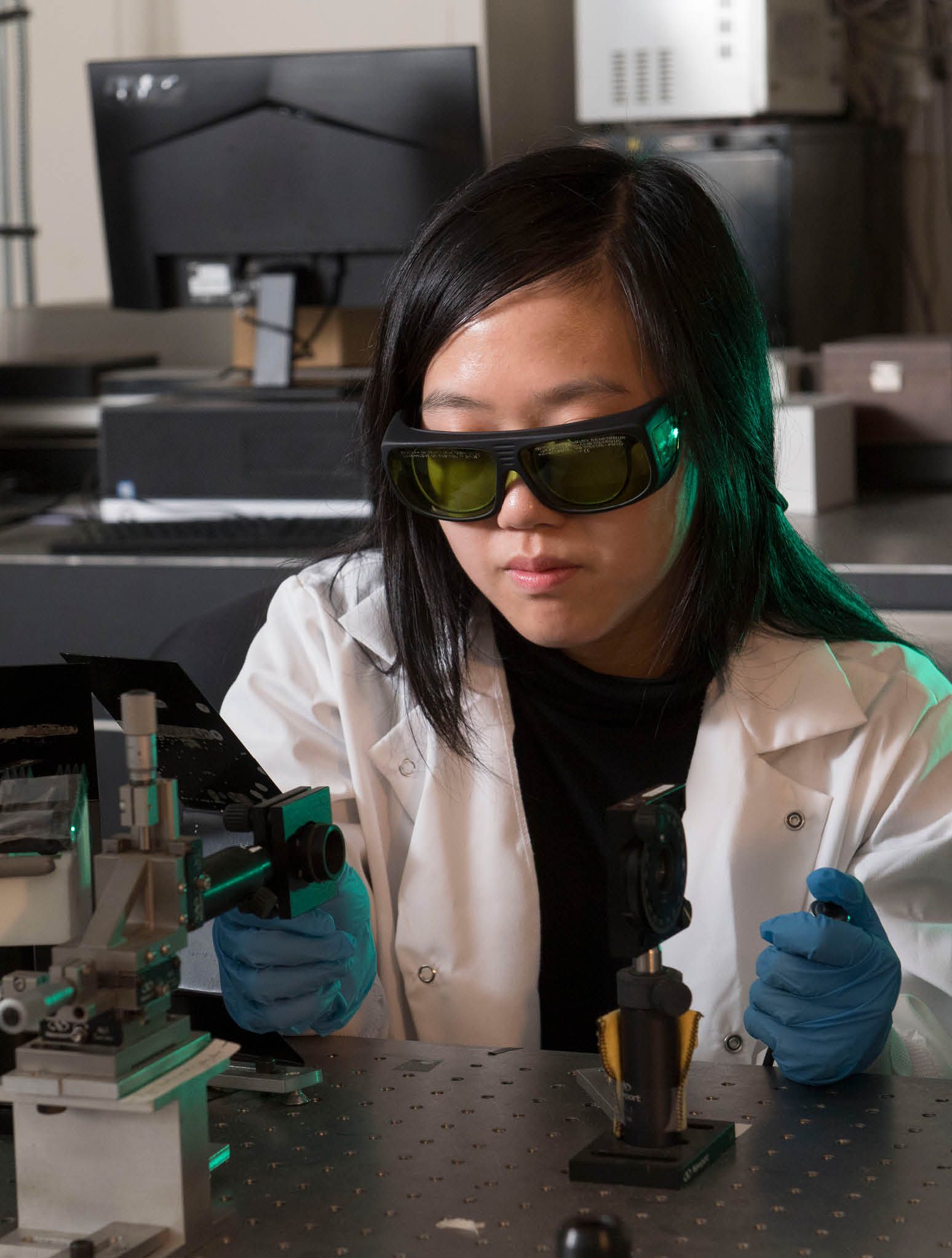 A woman using a microscope
