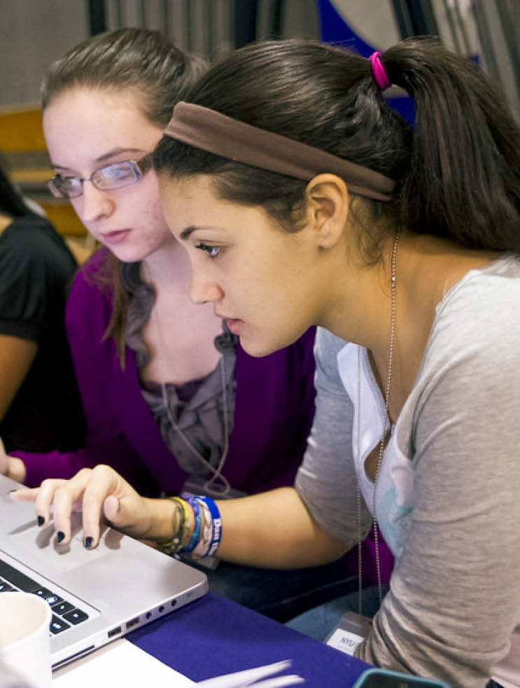 female students intently looking at computer screen