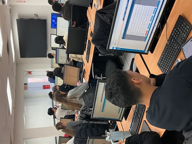 NYU engineering students participating in an FE exam preparation session in a computer classroom.