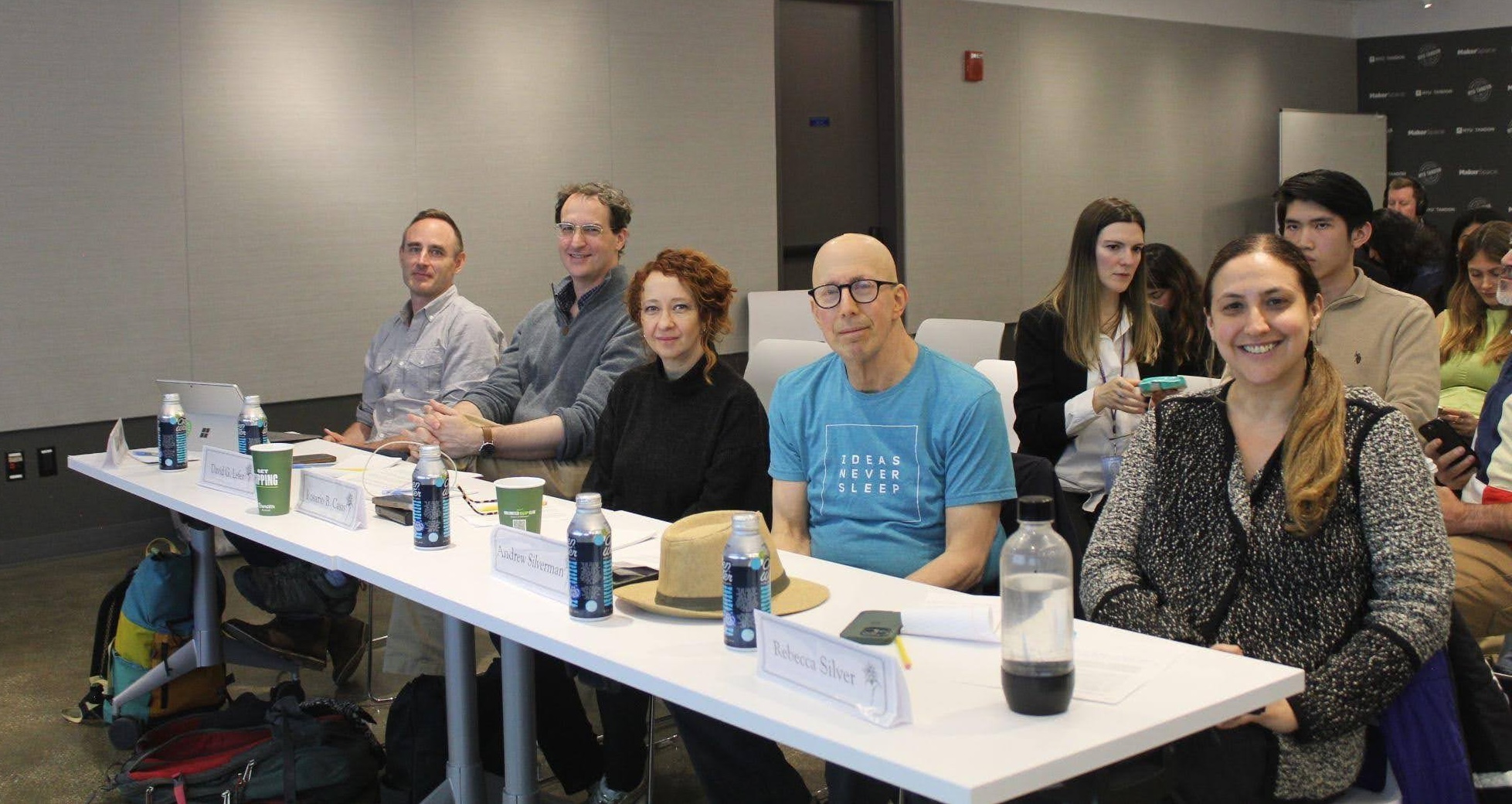 a panel of judges sitting at a conference table