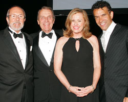 President Hultin, left, with the evening's honoree, Henry J. Singer, host Pat Carroll, morning news anchor, WCBS-AM Radio and Brian Stokes Mitchell, Tony Award-winning actor of stage and film, who delighted the audience with a musical performance. 
