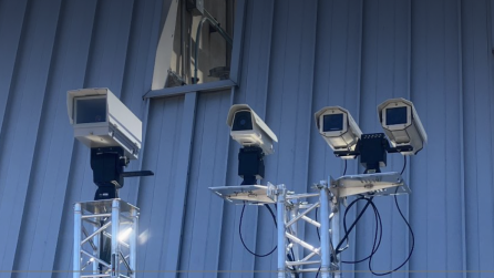 Four cameras mounted to a steel platform.