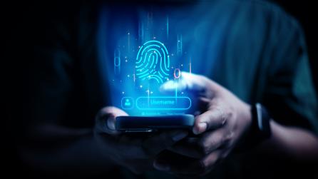 Person using phone, screen has username and fingerprint