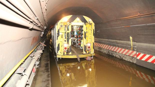 a subway car on a flooded track