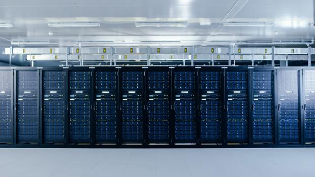 Image of a data center, with large computers lined up