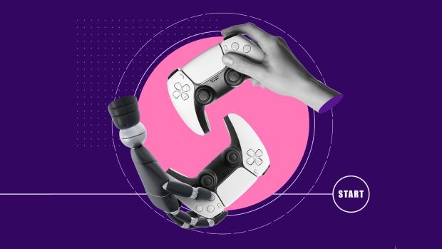 One human hand and one robot hand holding identical video game controllers