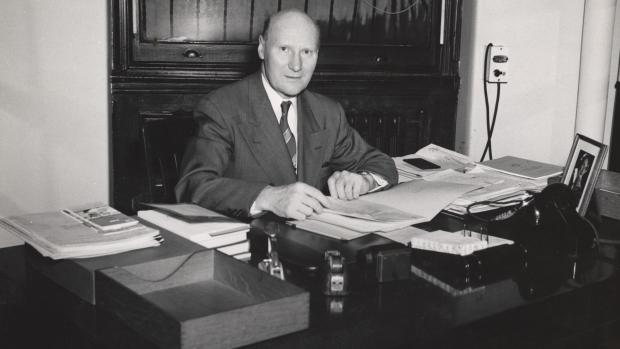 Ernst Weber seated at desk