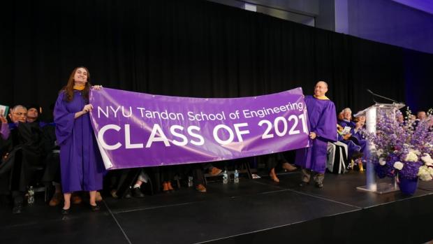 Class of 2021 banner held up by 2 people