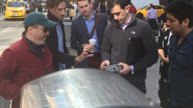 Assistant Professor Constantine Kontokosta (second from right) works with sensors developed by his lab that generate data to better understand how cities work.