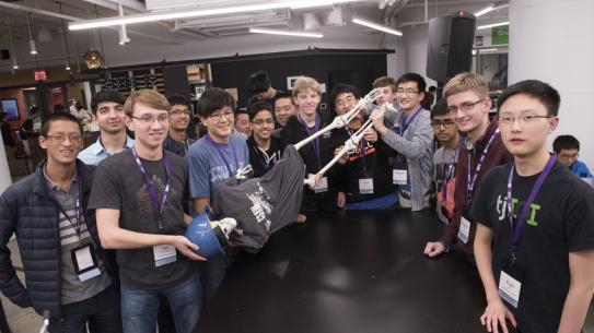 CSAW participants holding a skeleton