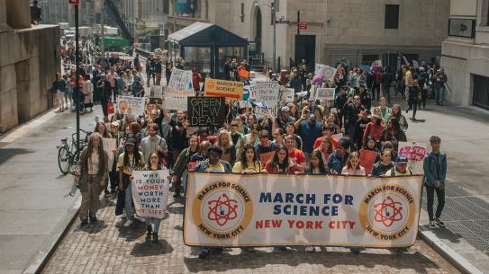 students marching in street