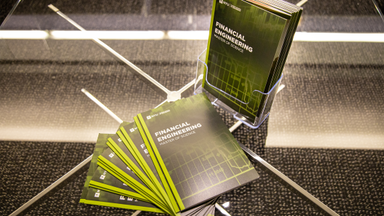 Masters in Financial Engineering pamphlets, sprawled on a table
