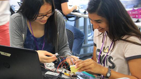 iesosc students working on a circuit