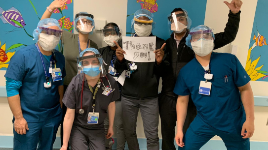group of doctors wearing face shields