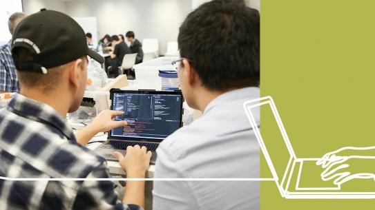 students looking at laptop