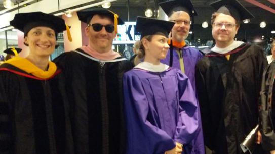 group of faculty in academic gowns