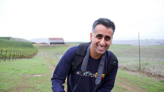 Filmmaker, Sanjay Rawal, in a foggy field