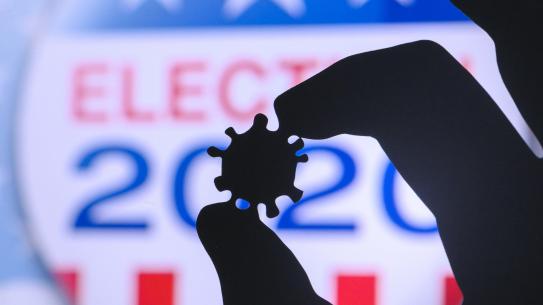 2020 Election Sticker with person holding virus shaped object