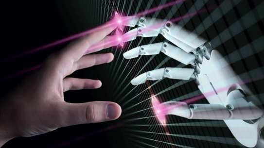 a human hand touching a robot hand at the finger tips