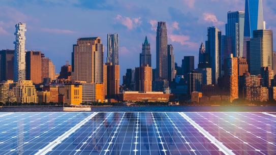 solar panels with NYC skyline in background