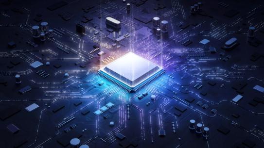A computer chip illuminated in the middle of a circuit board