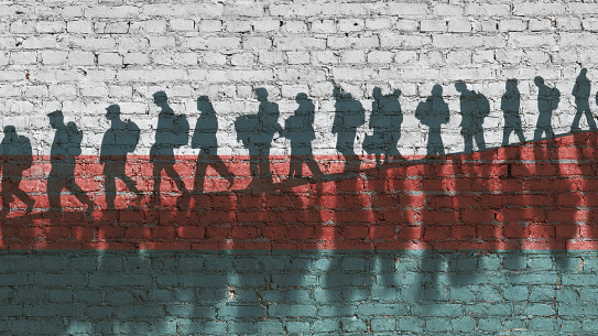 Illustration of a line of silhouettes of migrants walking in a line.