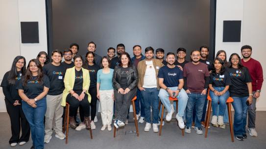 large group photo of hackathon participants wearing Goggle tshirts