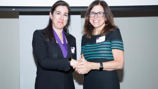 Semiha Ergan shaking hands with NYU Provost Georgina Dopico
