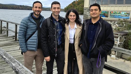 Omar Wani (left) and Omid Emamjomehzadeh (second from left), with fellow researchers from Wani's  Hydrologic Systems Group Berina Kilicarslan and Mario Ponce Pacheco, posing for a group photo in New York.
