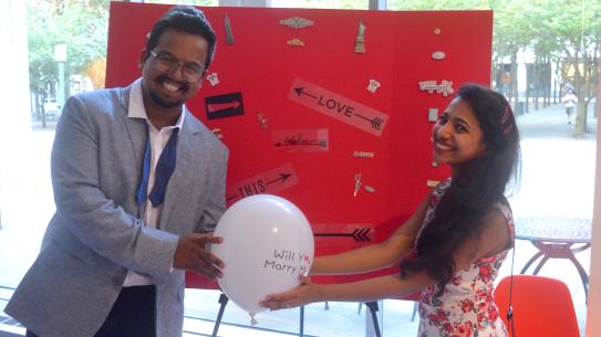 students holding a balloon