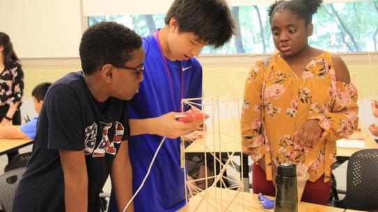 Middle school students work on a science project