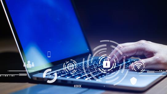 Hand on laptop typing with lock superimposed