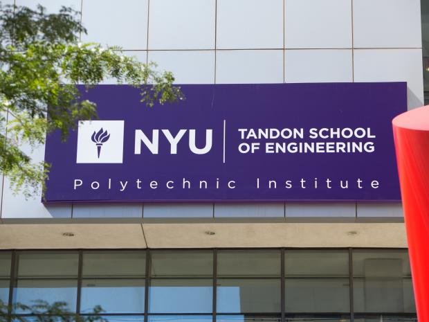 Purple NYU Tandon School of Engineering sign on building