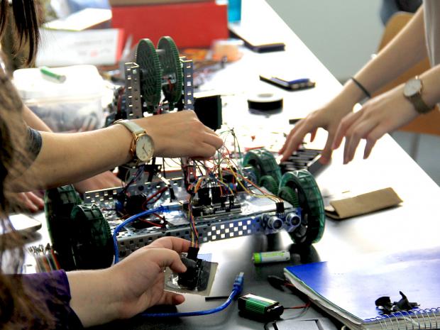 hands working on robot