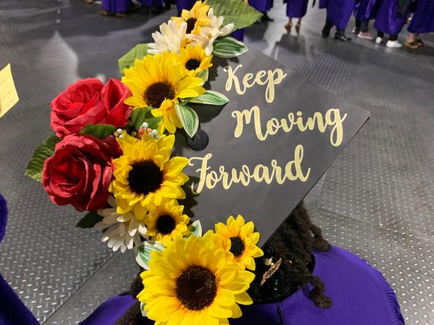 Graduation cap decorated with message "Keep moving forward"