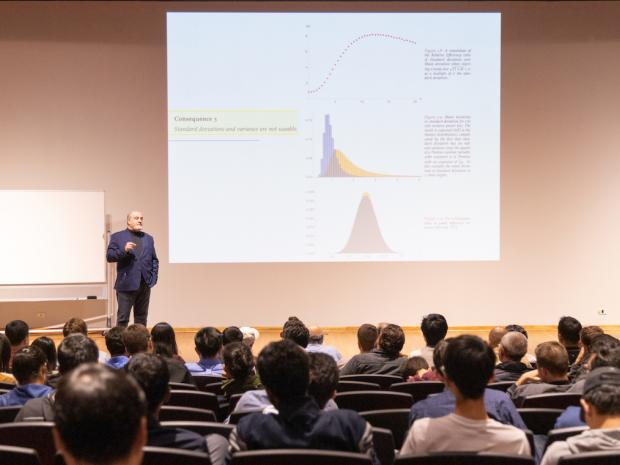 Professor Taleb gives a lecture in a full auditorium