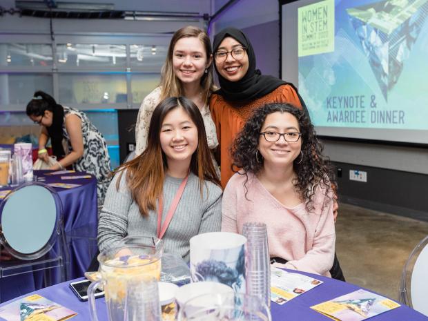 4 diverse female students at women in STEM summit