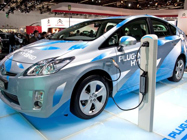 electric vehicle plugged in at an auto show