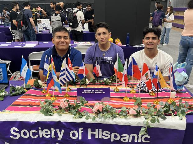 SHPE club table covered in flags from Latin America 