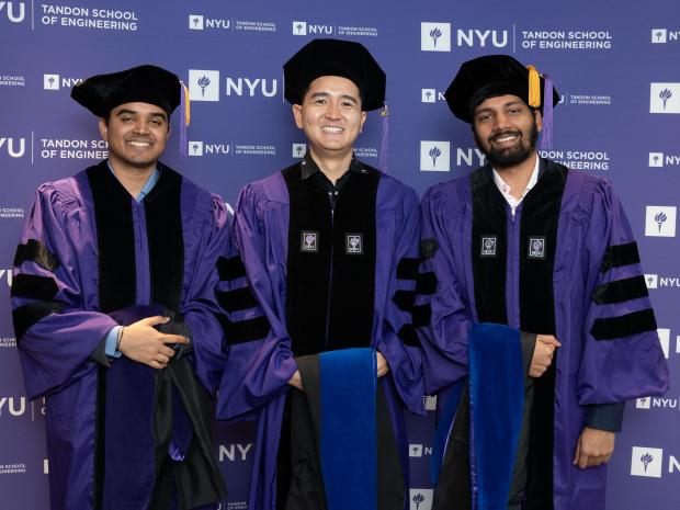 PhD students wearing graduation attire