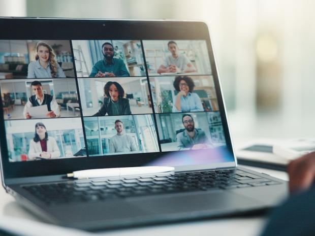 laptop display a grid of people on a video call