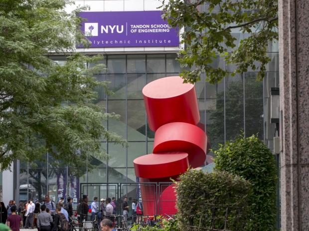 red sculpture outside on a campus building with purple NYU Tandon signage